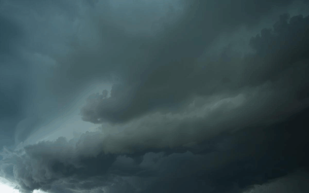 Dark storm clouds rolling in over a Texas home, with subtle roof damage visible indicating the 25% rule in Texas.